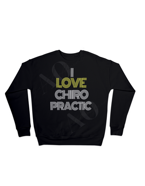 Black crewneck sweater against a white background. Crewneck says I Love Chiropractic in white letters. The word Love is in yellow letters